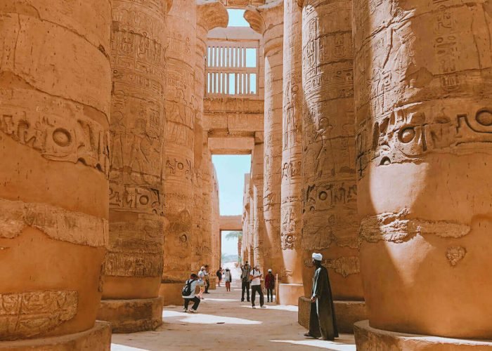 A-picture-of-some-visitors-near-the-columns-of-Karnak-Temple