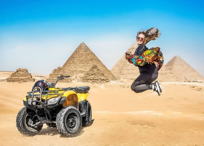 A-wonderful-shot-of-a-tourist-with-a-quad-bike-in-front-of-the-Pyramids-of-Giza