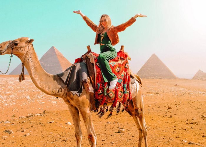 a-wonderful-shot-of-a-girl-on-the-camel-in-front-of-the-pyramids